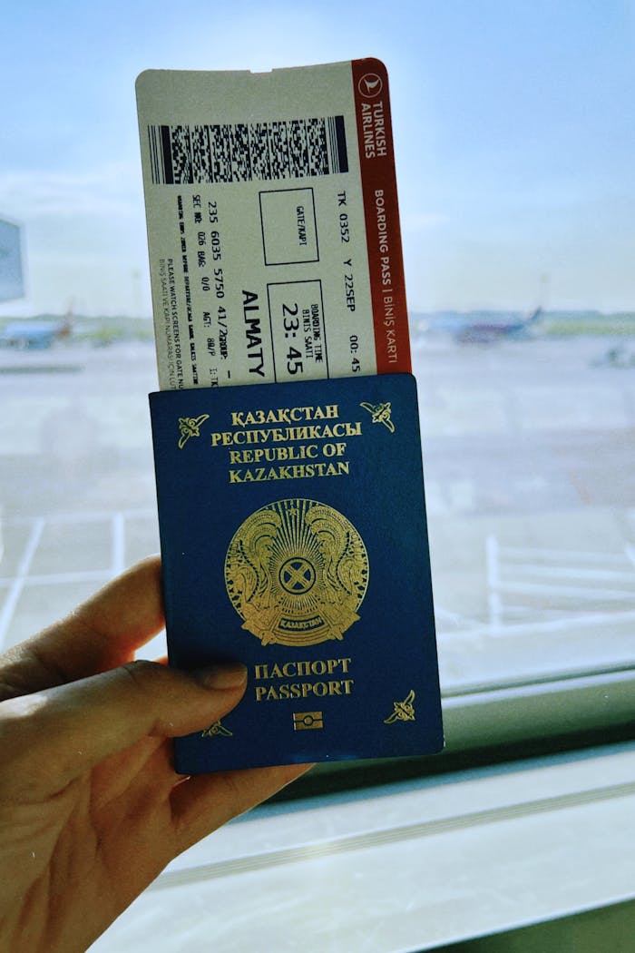 Kazakhstan Passport and Boarding Pass at Airport